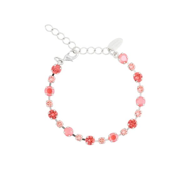 Armband i rhodiumpläterad mässing med facetterade Swarovski-kristaller i varm korallrosa ton
