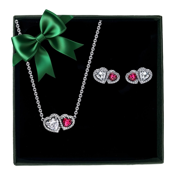 Presentset med stiftörhängen och halsband med dubbla hjärtan och glittrande stenar. Symboliserar kärlek och betydelse. Levereras presentinslaget för hand.