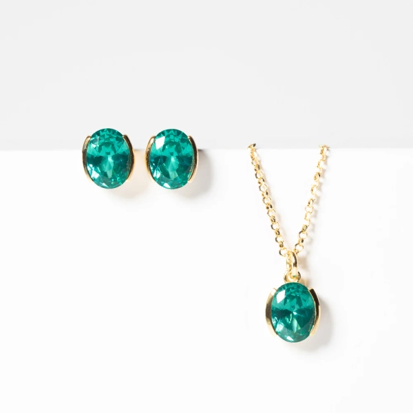 Ellisse Carezza Örhängen i turkos och guld med gnistrande cubic zirconia