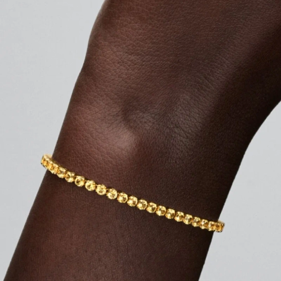 Gult tennisarmband med gul kristall och 14K guldplätering från Pandora Timeless kollektionen. Skapar trendig och sofistikerad framtoning