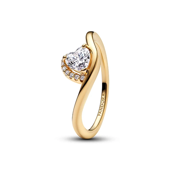 Welliger Ring mit herzförmigem Stein aus Gold. Ring mit herzförmigem Zirkonia und Pavé-Steinen. Mit 14 Karat Gold überzogen