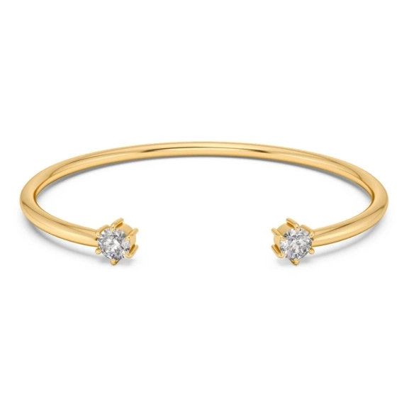 Guldpläterat öppet armband från Edblad med två cubic zirkonia-stenar vid ändarna