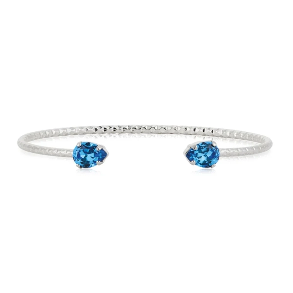 Armband i rhodiumpläterad mässing med två isblå Swarovski® kristaller