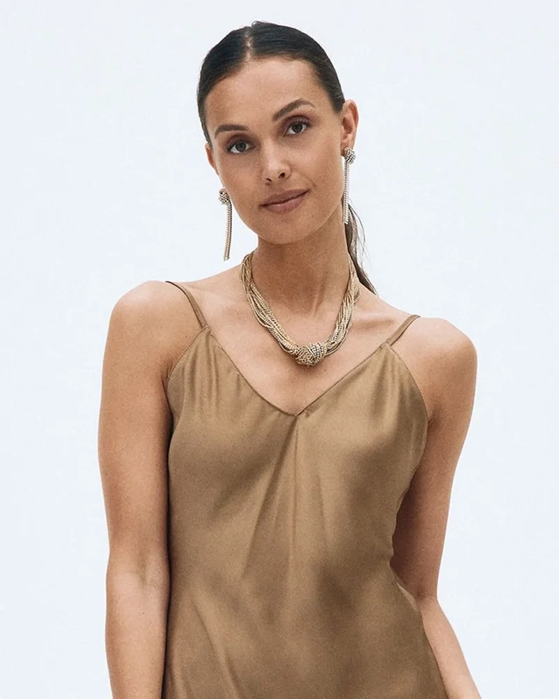 Örhängen i 14K guldplätering med knutdesign och cubic zirconia-stenar