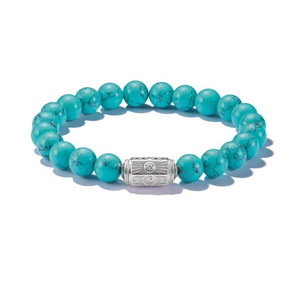 Armband Beads Turkos från Thomas Sabo med imiterade turkospärlor och silverdetalj med lyckosymboler.