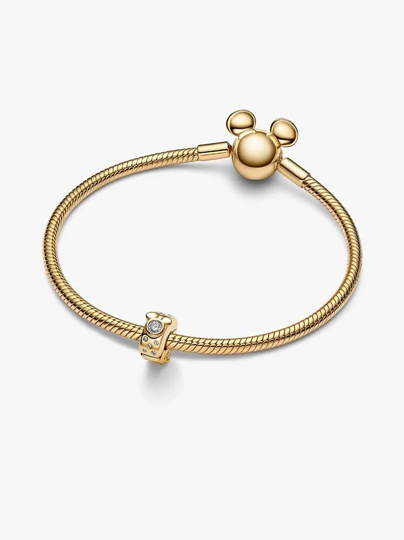 Musse och Mimmi Pigg clipberlock i guld med strålande stenar. Disney x Pandora kollektion. Låt deras magiska charm lysa upp din smyckessamling.