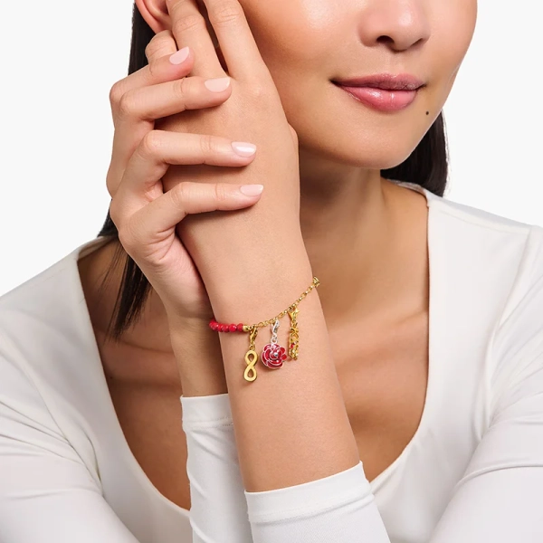 KISS med Vita Stenar Berlock Guld - Thomas Sabo - Snabb leverans & paketinslagning - Nordic Spectra