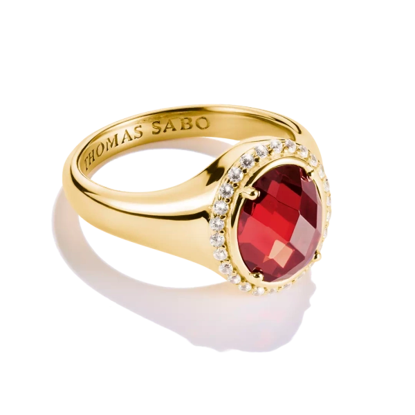 Rund Röd Ring Guld från Thomas Sabo med oval röd zirkonia och pavé-halo på 18K guldpläterat silver.